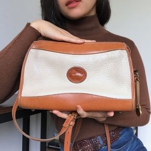 Dooney & Bourke cream and brown leather bag